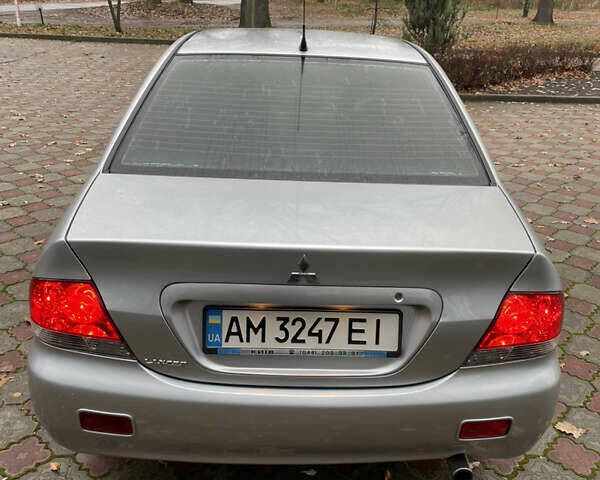 Сірий Міцубісі Lancer, об'ємом двигуна 1.59 л та пробігом 219 тис. км за 4500 $, фото 6 на Automoto.ua
