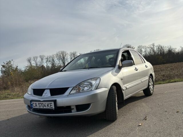 Серый Мицубиси Лансер, объемом двигателя 1.6 л и пробегом 228 тыс. км за 4500 $, фото 1 на Automoto.ua