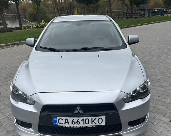 Серый Мицубиси Лансер, объемом двигателя 2 л и пробегом 211 тыс. км за 7100 $, фото 3 на Automoto.ua