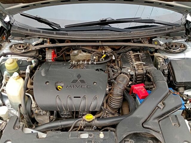 Серый Мицубиси Лансер, объемом двигателя 2 л и пробегом 243 тыс. км за 5500 $, фото 13 на Automoto.ua