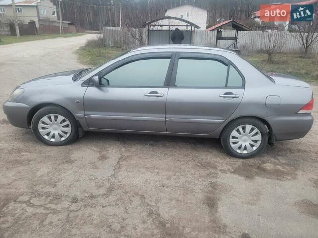 Сірий Міцубісі Lancer, об'ємом двигуна 1.6 л та пробігом 440 тис. км за 4200 $, фото 4 на Automoto.ua