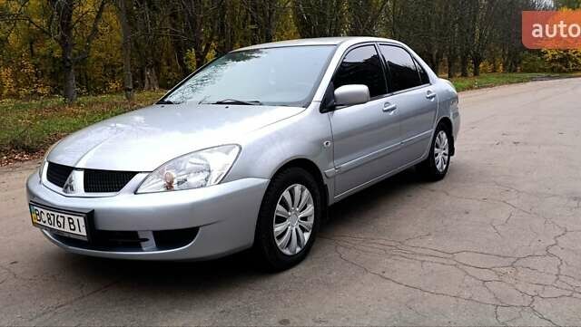 Серый Мицубиси Лансер, объемом двигателя 1.58 л и пробегом 176 тыс. км за 5000 $, фото 2 на Automoto.ua