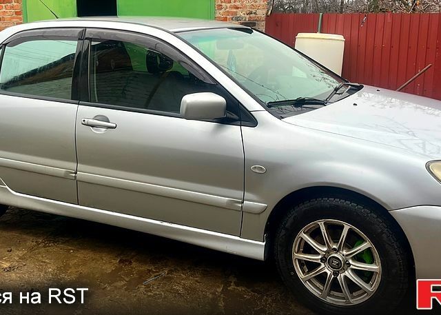 Сірий Міцубісі Lancer, об'ємом двигуна 1.6 л та пробігом 282 тис. км за 4699 $, фото 1 на Automoto.ua