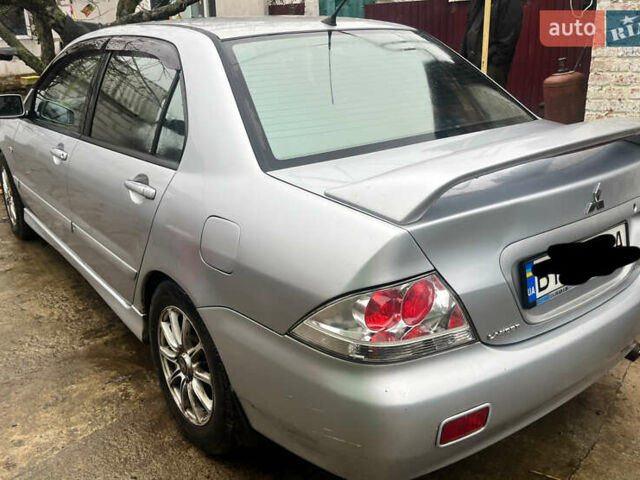 Серый Мицубиси Лансер, объемом двигателя 1.6 л и пробегом 282 тыс. км за 4699 $, фото 2 на Automoto.ua