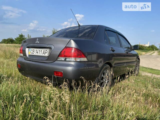 Сірий Міцубісі Lancer, об'ємом двигуна 1.6 л та пробігом 165 тис. км за 5200 $, фото 5 на Automoto.ua