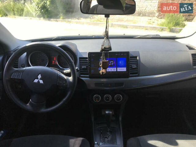 Серый Мицубиси Лансер, объемом двигателя 2 л и пробегом 256 тыс. км за 7000 $, фото 5 на Automoto.ua