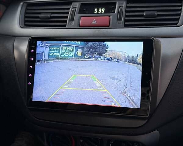 Серый Мицубиси Лансер, объемом двигателя 1.58 л и пробегом 145 тыс. км за 4800 $, фото 1 на Automoto.ua