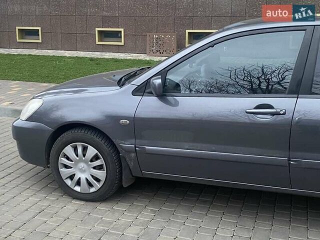 Сірий Міцубісі Lancer, об'ємом двигуна 1.6 л та пробігом 250 тис. км за 3500 $, фото 4 на Automoto.ua