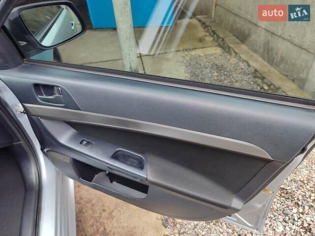 Серый Мицубиси Лансер, объемом двигателя 2 л и пробегом 234 тыс. км за 7200 $, фото 21 на Automoto.ua