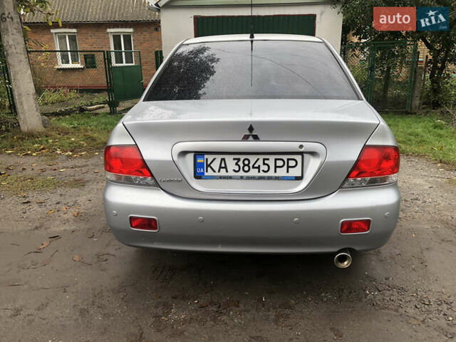 Сірий Міцубісі Lancer, об'ємом двигуна 1.58 л та пробігом 240 тис. км за 4299 $, фото 6 на Automoto.ua