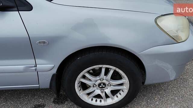 Серый Мицубиси Лансер, объемом двигателя 1.58 л и пробегом 216 тыс. км за 4700 $, фото 1 на Automoto.ua