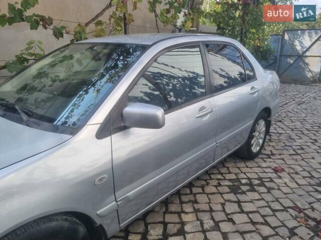 Сірий Міцубісі Lancer, об'ємом двигуна 1.6 л та пробігом 290 тис. км за 3850 $, фото 12 на Automoto.ua