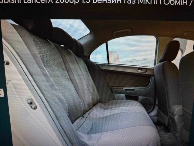 Серый Мицубиси Лансер, объемом двигателя 1.5 л и пробегом 235 тыс. км за 6500 $, фото 12 на Automoto.ua
