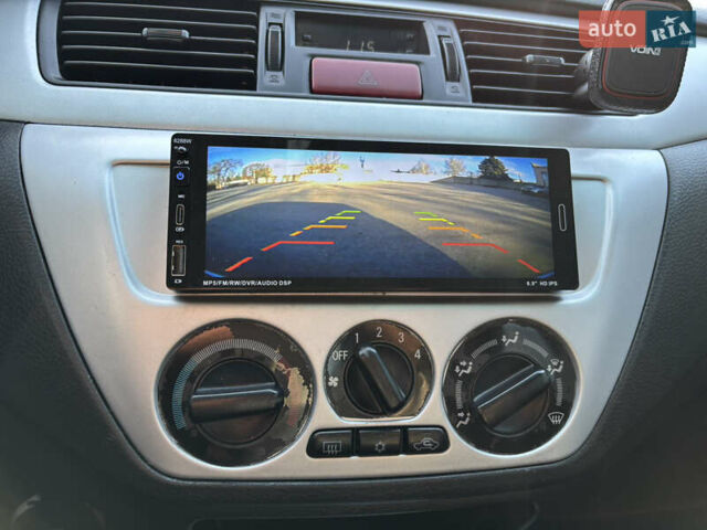 Серый Мицубиси Лансер, объемом двигателя 1.6 л и пробегом 193 тыс. км за 4000 $, фото 18 на Automoto.ua