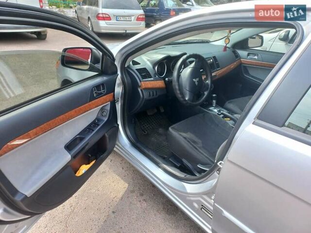 Серый Мицубиси Лансер, объемом двигателя 2 л и пробегом 103 тыс. км за 7700 $, фото 13 на Automoto.ua