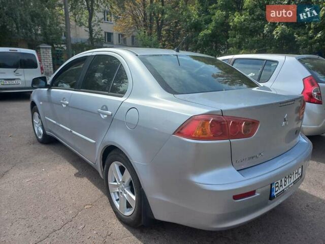 Серый Мицубиси Лансер, объемом двигателя 2 л и пробегом 103 тыс. км за 7700 $, фото 6 на Automoto.ua