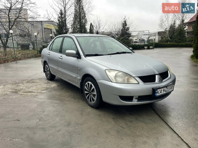 Сірий Міцубісі Lancer, об'ємом двигуна 1.58 л та пробігом 220 тис. км за 5900 $, фото 1 на Automoto.ua