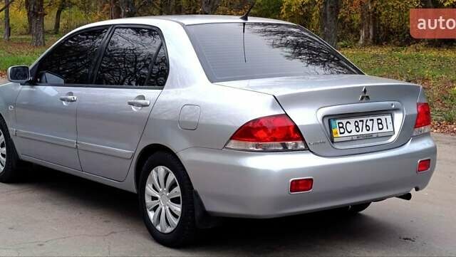 Серый Мицубиси Лансер, объемом двигателя 1.58 л и пробегом 176 тыс. км за 5000 $, фото 6 на Automoto.ua