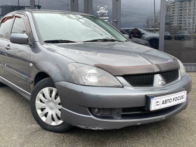 Серый Мицубиси Лансер, объемом двигателя 1.6 л и пробегом 146 тыс. км за 5990 $, фото 1 на Automoto.ua