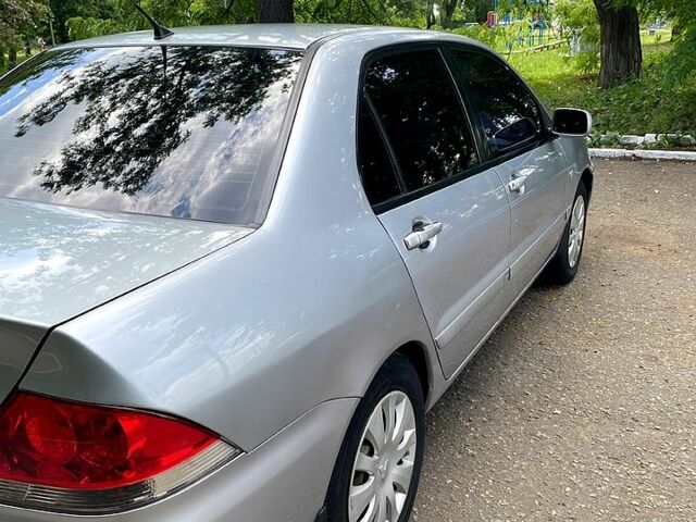 Сірий Міцубісі Lancer, об'ємом двигуна 1.6 л та пробігом 204 тис. км за 4500 $, фото 3 на Automoto.ua