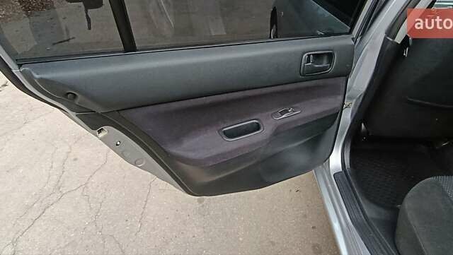 Серый Мицубиси Лансер, объемом двигателя 1.58 л и пробегом 176 тыс. км за 5000 $, фото 22 на Automoto.ua