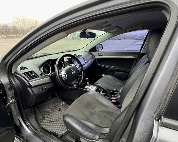 Серый Мицубиси Лансер, объемом двигателя 2 л и пробегом 203 тыс. км за 4999 $, фото 17 на Automoto.ua