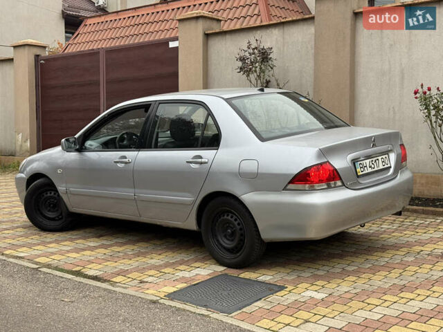 Сірий Міцубісі Lancer, об'ємом двигуна 1.6 л та пробігом 221 тис. км за 3650 $, фото 7 на Automoto.ua