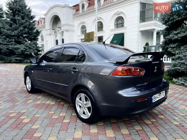 Серый Мицубиси Лансер, объемом двигателя 2 л и пробегом 212 тыс. км за 6000 $, фото 6 на Automoto.ua