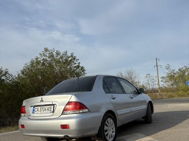 Серый Мицубиси Лансер, объемом двигателя 1.6 л и пробегом 228 тыс. км за 4500 $, фото 2 на Automoto.ua
