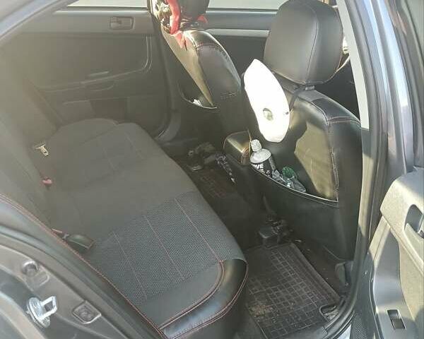 Сірий Міцубісі Lancer, об'ємом двигуна 2 л та пробігом 300 тис. км за 5500 $, фото 1 на Automoto.ua