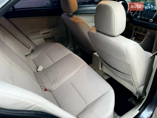 Серый Мицубиси Лансер, объемом двигателя 2 л и пробегом 212 тыс. км за 6000 $, фото 23 на Automoto.ua