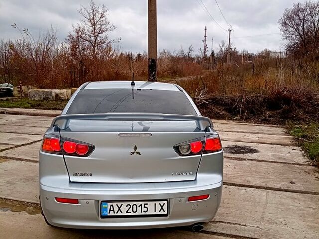 Серый Мицубиси Лансер, объемом двигателя 2 л и пробегом 243 тыс. км за 5500 $, фото 1 на Automoto.ua