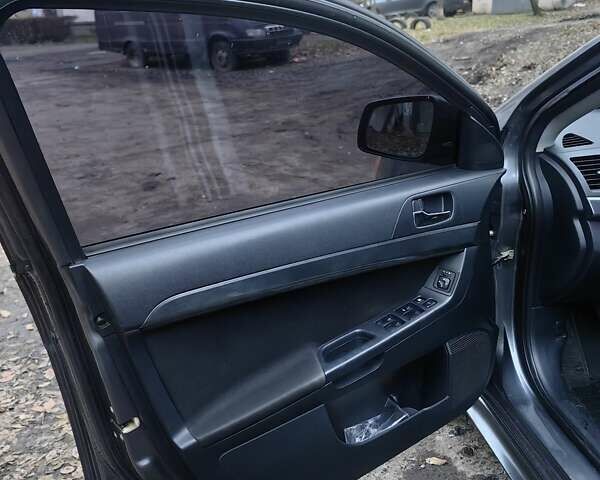 Сірий Міцубісі Lancer, об'ємом двигуна 2 л та пробігом 186 тис. км за 6000 $, фото 16 на Automoto.ua
