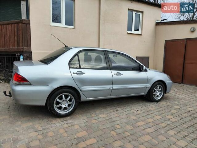 Серый Мицубиси Лансер, объемом двигателя 1.58 л и пробегом 185 тыс. км за 4700 $, фото 5 на Automoto.ua