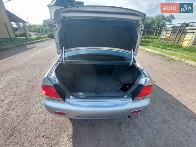Серый Мицубиси Лансер, объемом двигателя 1.6 л и пробегом 117 тыс. км за 3980 $, фото 10 на Automoto.ua