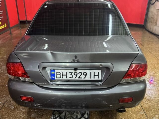 Серый Мицубиси Лансер, объемом двигателя 1.6 л и пробегом 268 тыс. км за 4600 $, фото 4 на Automoto.ua