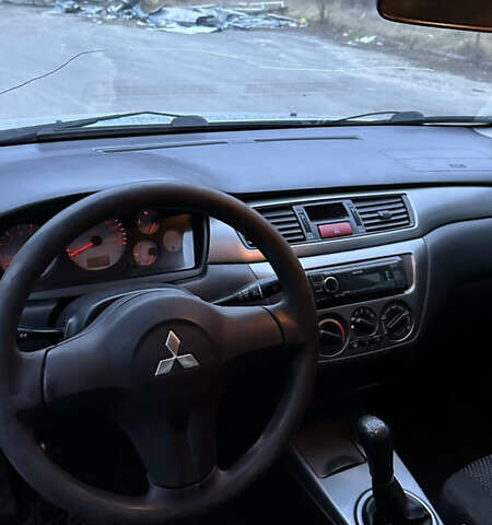 Сірий Міцубісі Lancer, об'ємом двигуна 1.58 л та пробігом 180 тис. км за 3900 $, фото 5 на Automoto.ua