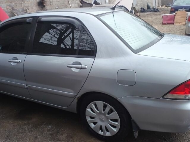 Сірий Міцубісі Lancer, об'ємом двигуна 1.6 л та пробігом 320 тис. км за 4167 $, фото 4 на Automoto.ua