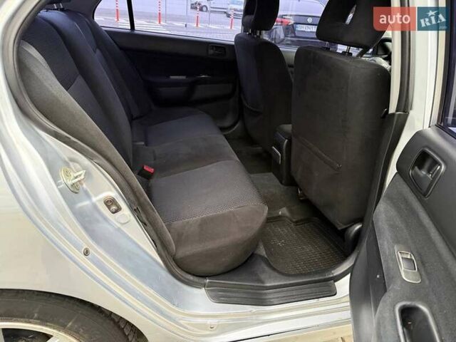 Сірий Міцубісі Lancer, об'ємом двигуна 1.6 л та пробігом 206 тис. км за 4799 $, фото 23 на Automoto.ua