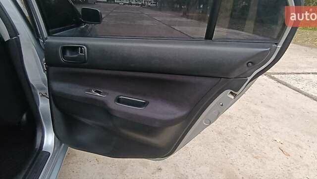 Сірий Міцубісі Lancer, об'ємом двигуна 1.6 л та пробігом 176 тис. км за 4999 $, фото 22 на Automoto.ua