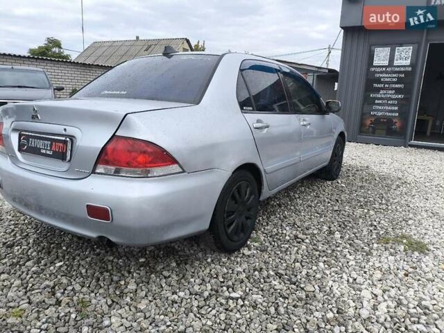 Сірий Міцубісі Lancer, об'ємом двигуна 1.6 л та пробігом 240 тис. км за 2999 $, фото 15 на Automoto.ua