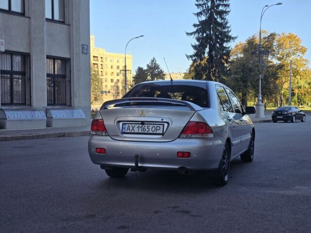 Серый Мицубиси Лансер, объемом двигателя 1.6 л и пробегом 150 тыс. км за 4700 $, фото 2 на Automoto.ua