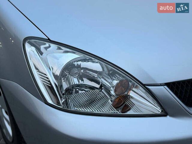 Серый Мицубиси Лансер, объемом двигателя 1.58 л и пробегом 34 тыс. км за 7500 $, фото 51 на Automoto.ua