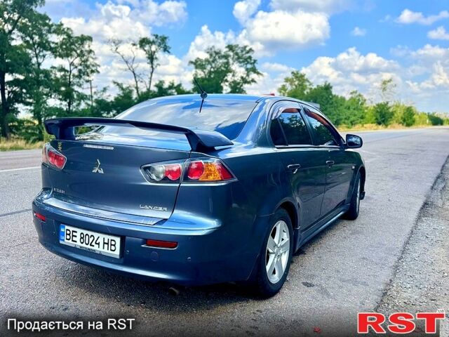 Серый Мицубиси Лансер, объемом двигателя 2 л и пробегом 250 тыс. км за 5800 $, фото 2 на Automoto.ua