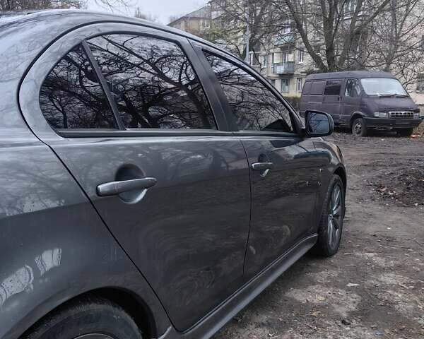 Сірий Міцубісі Lancer, об'ємом двигуна 2 л та пробігом 186 тис. км за 6000 $, фото 11 на Automoto.ua