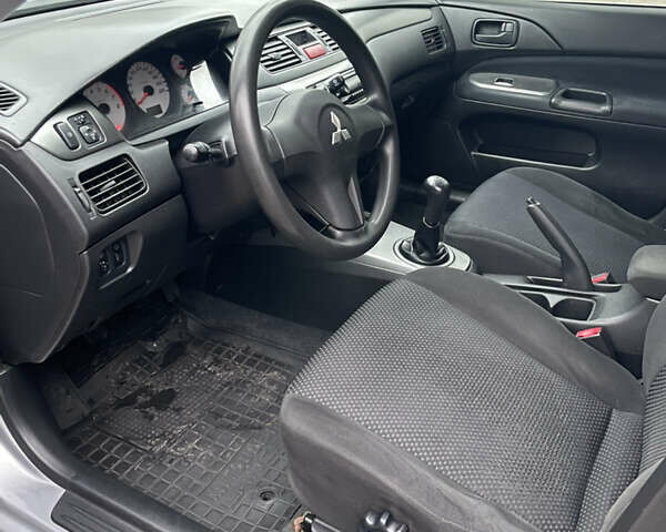 Сірий Міцубісі Lancer, об'ємом двигуна 1.59 л та пробігом 219 тис. км за 4500 $, фото 14 на Automoto.ua