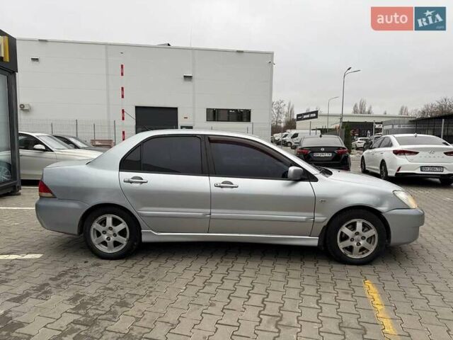 Сірий Міцубісі Lancer, об'ємом двигуна 1.6 л та пробігом 206 тис. км за 4799 $, фото 8 на Automoto.ua