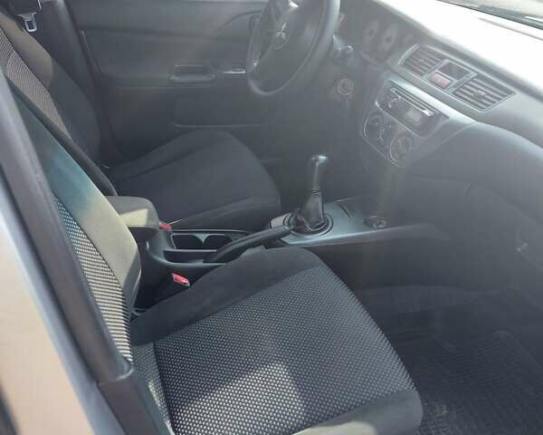 Серый Мицубиси Лансер, объемом двигателя 1.6 л и пробегом 117 тыс. км за 3980 $, фото 2 на Automoto.ua