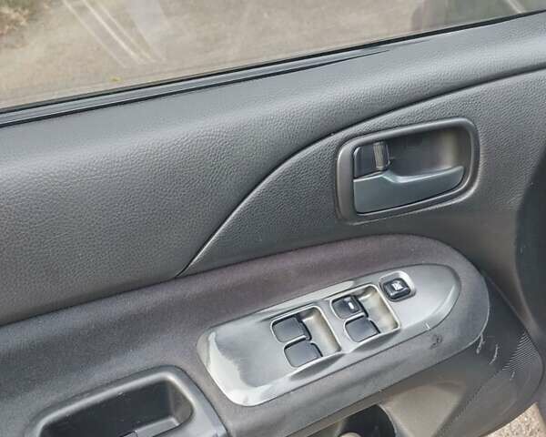 Сірий Міцубісі Lancer, об'ємом двигуна 1.58 л та пробігом 1 тис. км за 2850 $, фото 12 на Automoto.ua