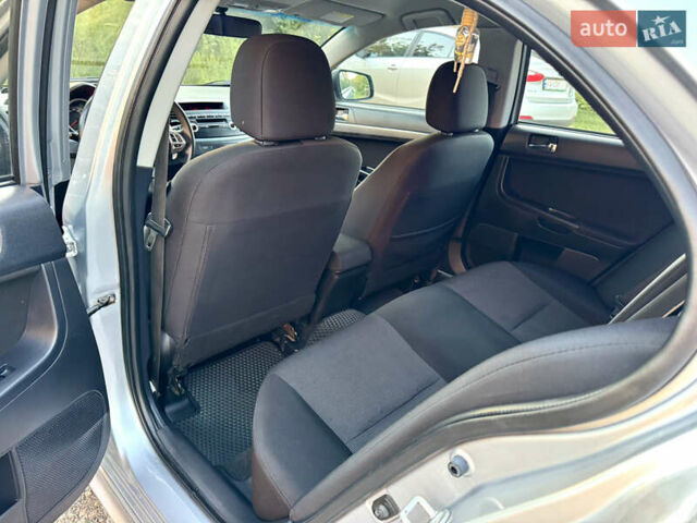Сірий Міцубісі Lancer, об'ємом двигуна 2 л та пробігом 223 тис. км за 7390 $, фото 13 на Automoto.ua